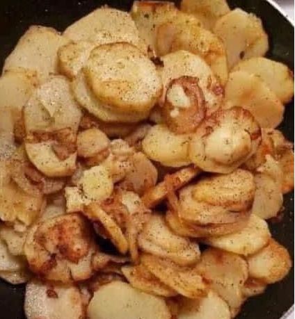 FRIED POTATOES ONIONS AND SMOKE POLISH SAUSAGE