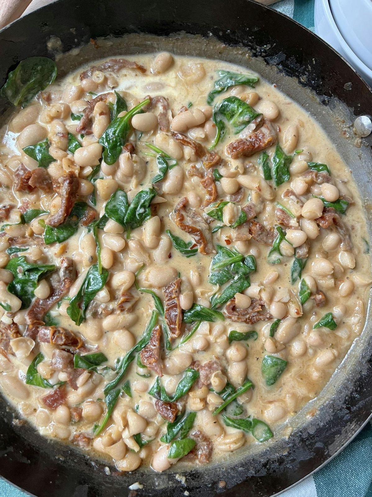 Savor the Comfort of Creamy White Beans with Spinach and Sun-Dried Tomatoes