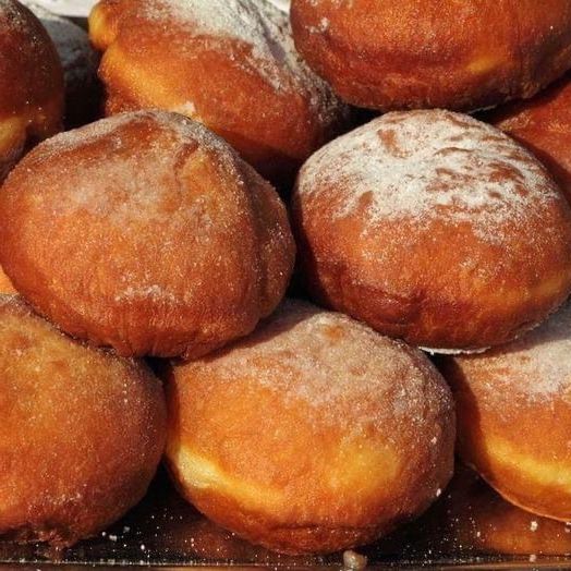 classic fried donuts dusted with powdered sugar