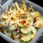 Creamy cucumber salad with cheese and bacon