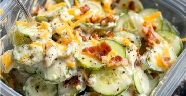 Creamy cucumber salad with cheese and bacon