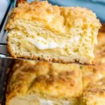 "A slice of cream cheese-filled coffee cake with golden cinnamon streusel topping"