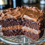 Slice of Double Chocolate Coca Cola Cake with creamy frosting